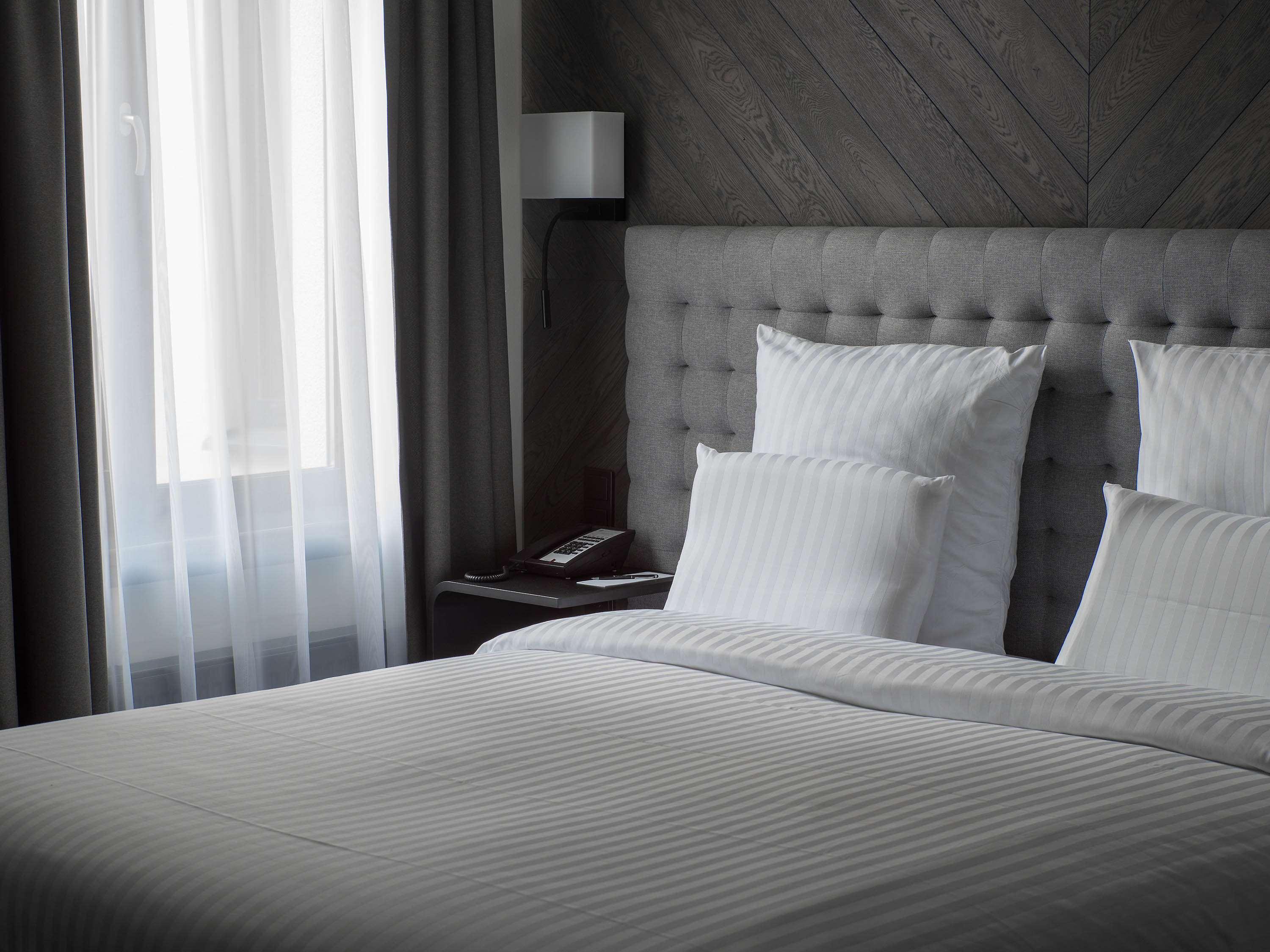 Pullman Riga Old Town Hotel Exterior foto A bed with white sheets
